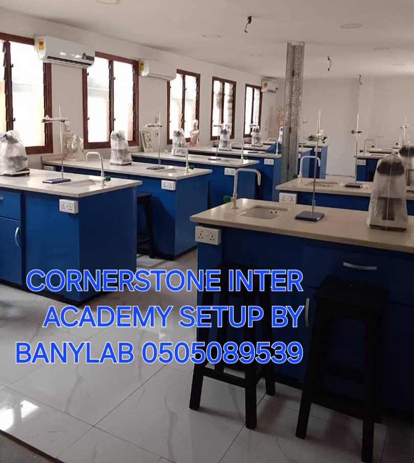 Cornerstone Academy equipped science laboratory with benches, sinks, stools, and equipment stands