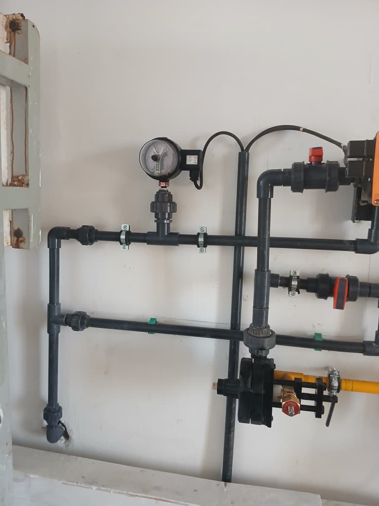 Pressure gauge and black service piping detail for laboratory installation