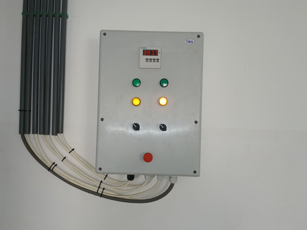 Electrical control panel with indicator lights and voltage display at Sekyere Hemmang