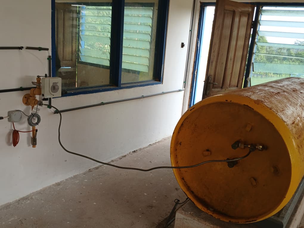 Tank service connection with wall-mounted control point at Sekyere Hemmang