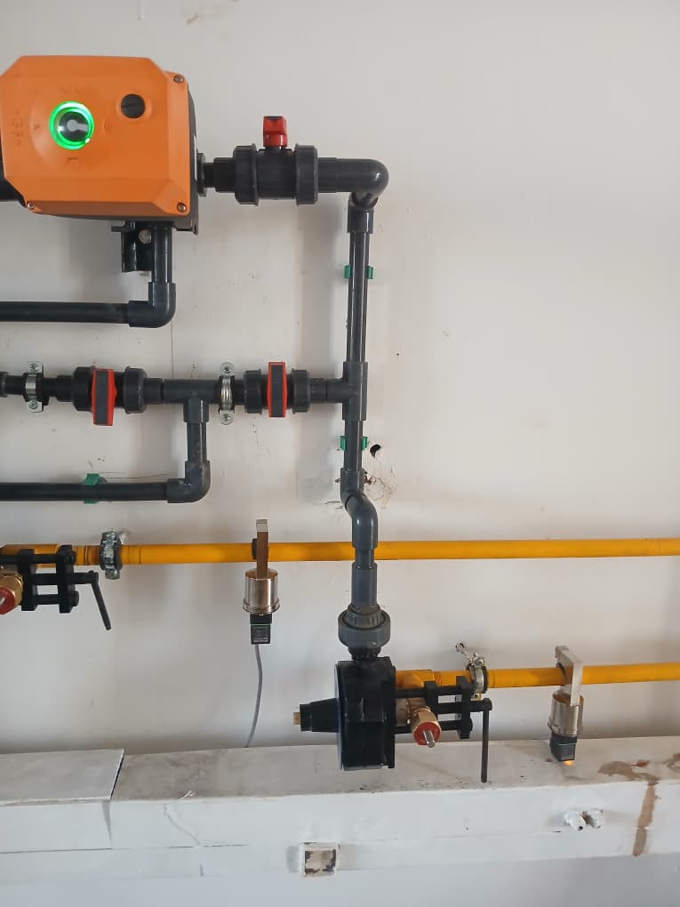 Automated service control panel connected to laboratory piping and shutoff valves